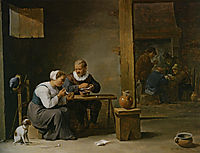 A man and woman smoking a pipe seated in an interior with peasants playing cards on a table, teniers